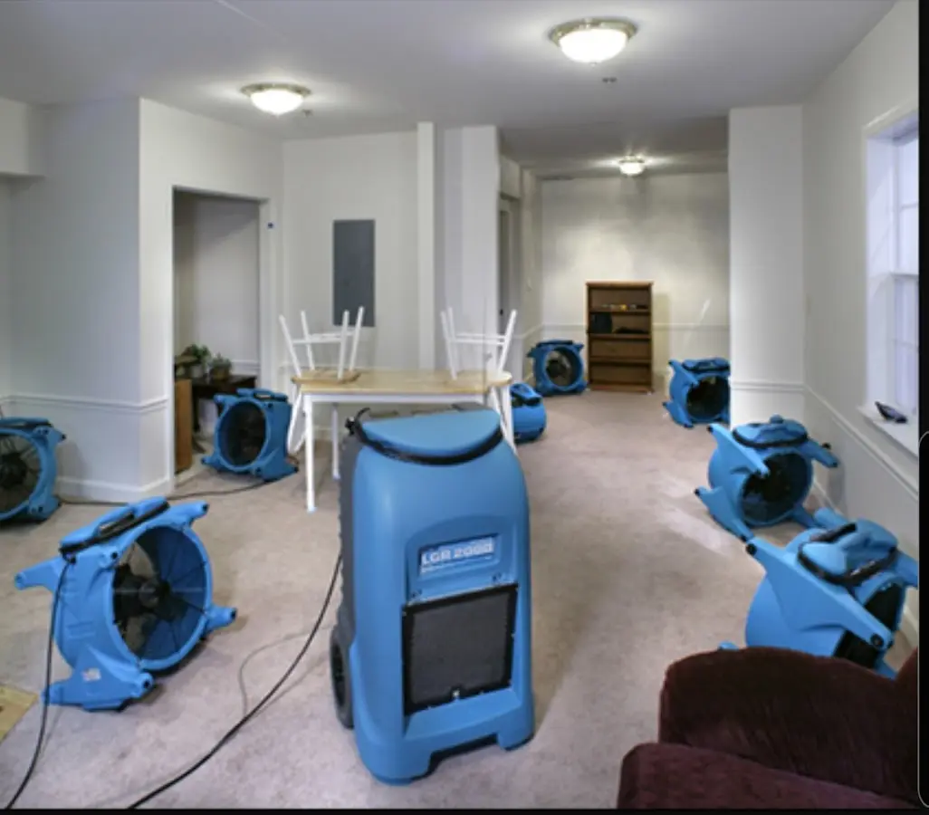 Air movers and dehumidifier setup for Water Damage Restoration in Keyes